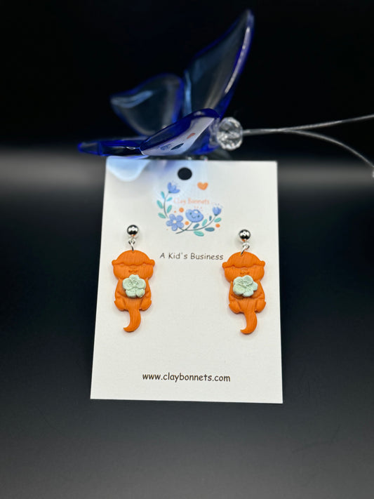 Cute Otter with a flower